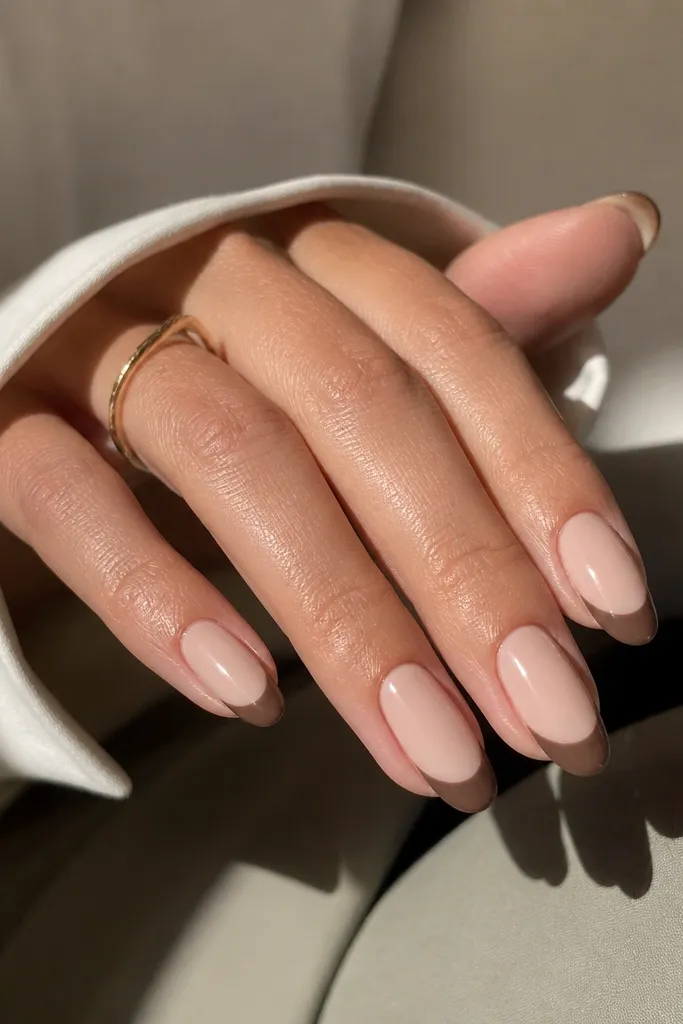 Low maintenance brown french tip nails almond
