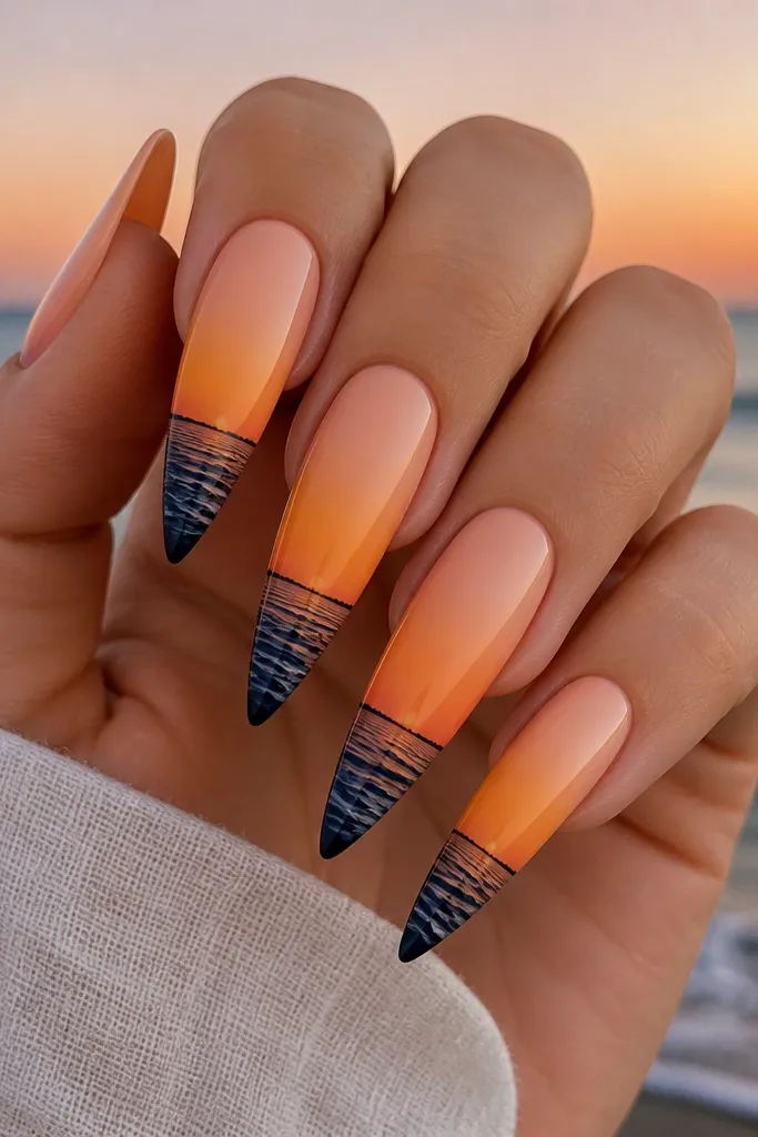 Long stiletto nails. Each nail shows a peach-to-orange sunset gradient. Near the tip are tiny dark wave shapes and a thin silhouette line like a distant shoreline.