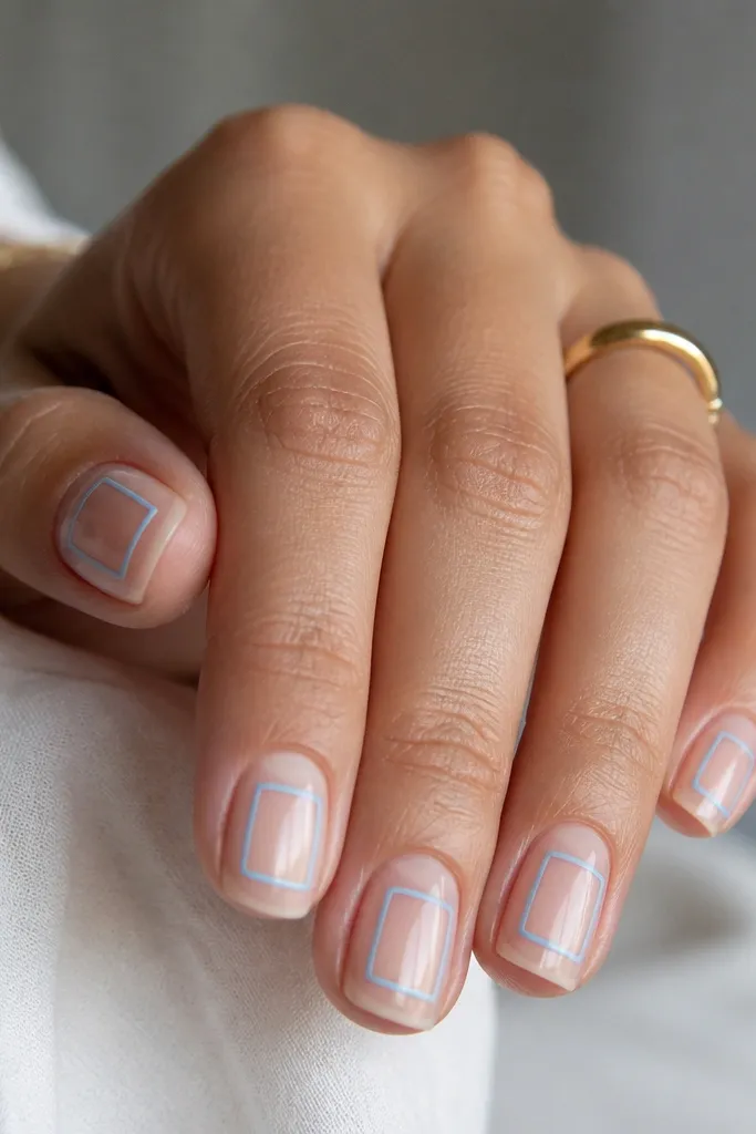 Clear nails with thin sky blue rectangular frames on each nail. The frames don't touch the sidewalls, leaving a clean gap around the edges.