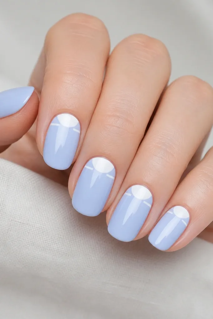 Five nails painted milky baby sky blue. At the cuticle, a clean white half-moon sits in the center. A thin white line runs straight from each side of the half-moon toward the center, stopping before the middle of the nail.