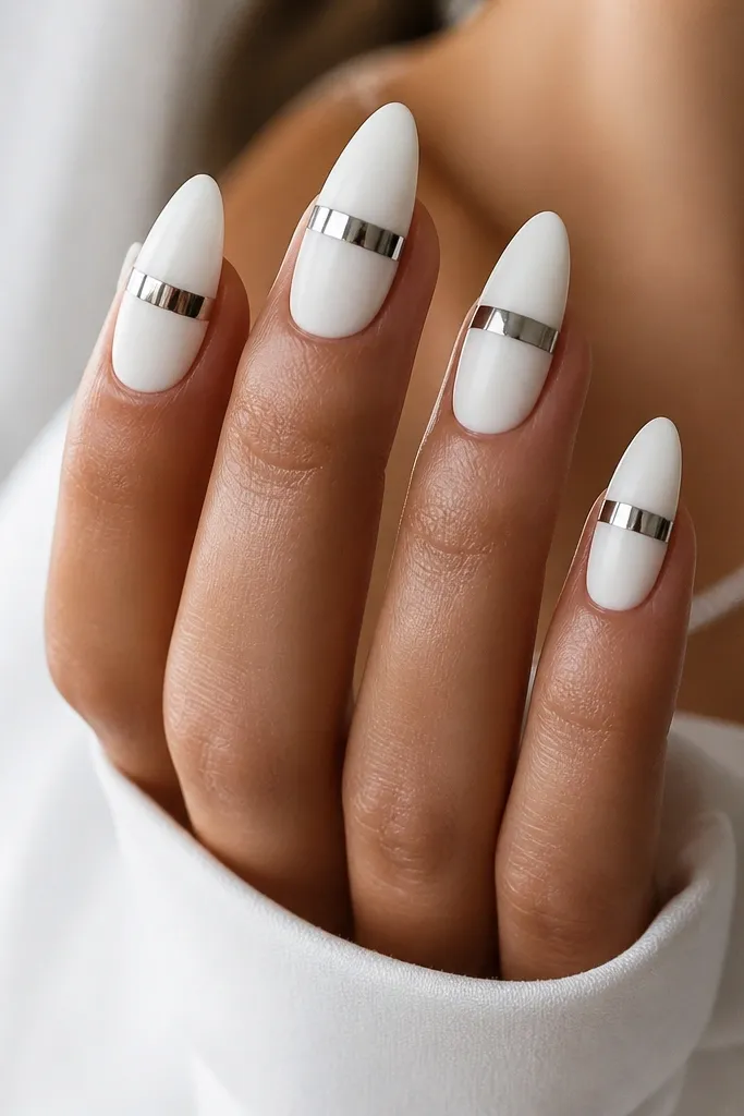 Almond nails with matte white on most of the nail and a glossy chrome band across the center, high contrast.